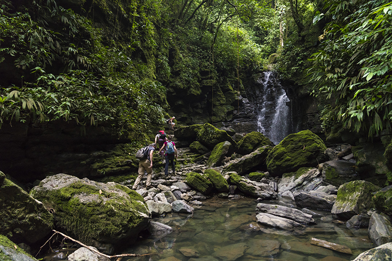 Small group of people at the waterfall